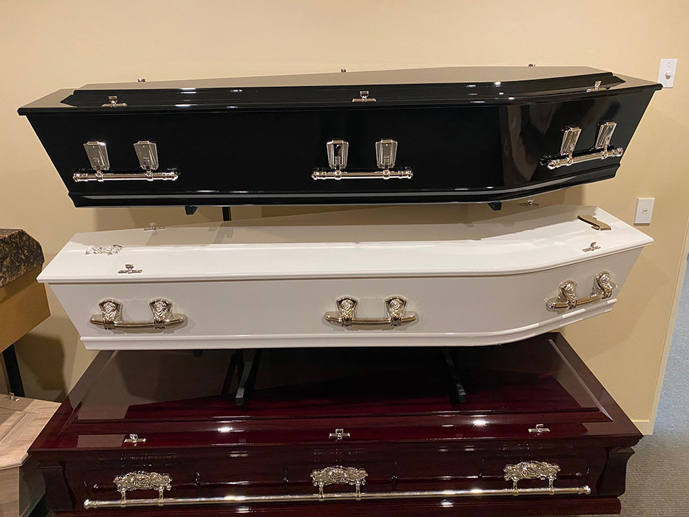 Caskets West Black, Standard White, Rosewood Couch
